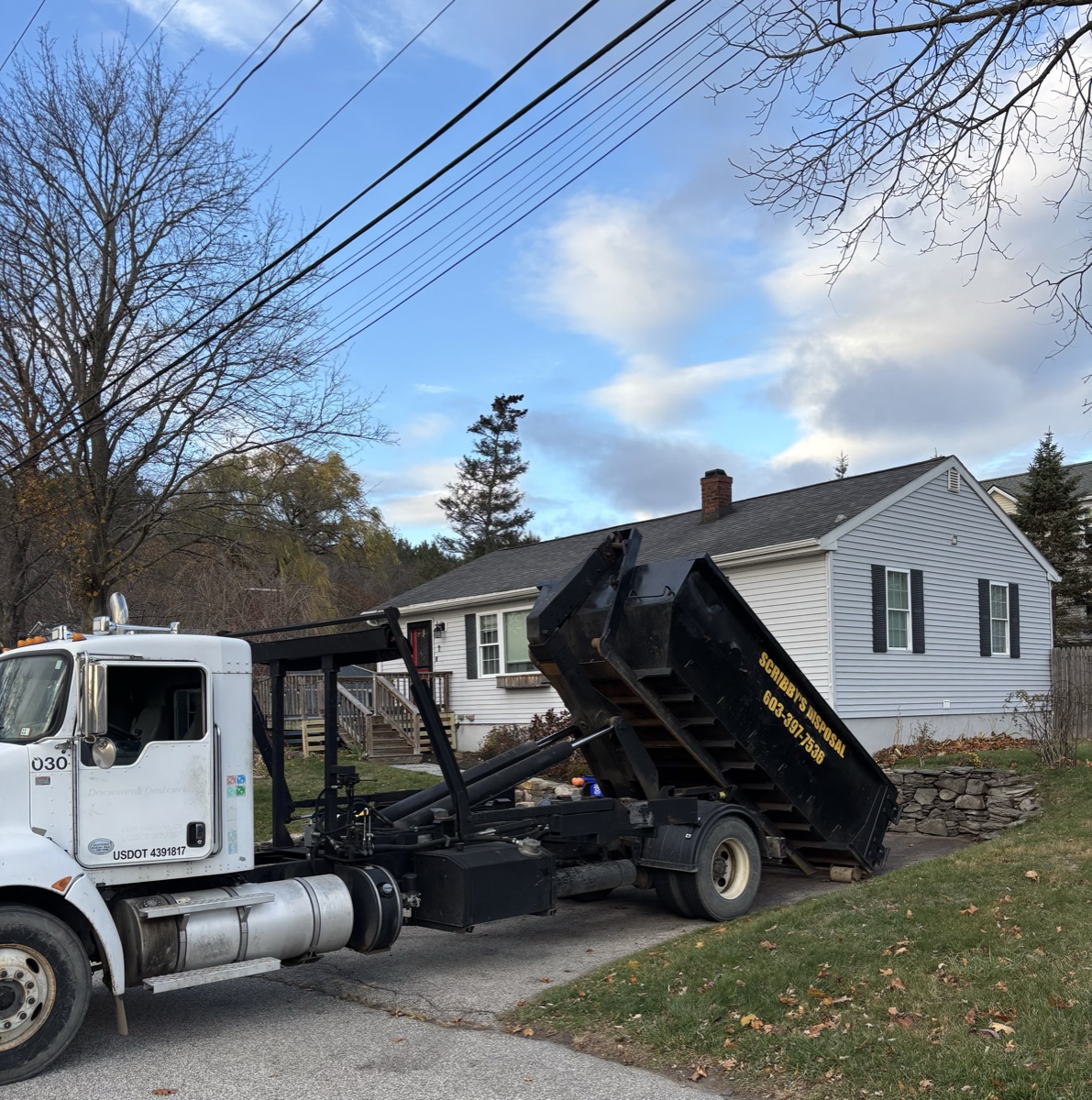 A Scribby's dumpster on a South Hampton driveway. Maybe a residential project on a rural road near the state line.