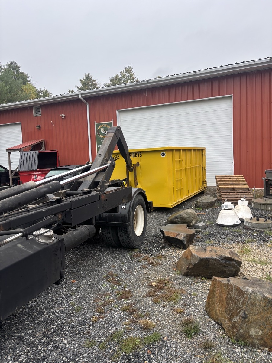 A Scribby's dumpster on an Epsom driveway. Maybe a residential project on a road near the Suncook River.