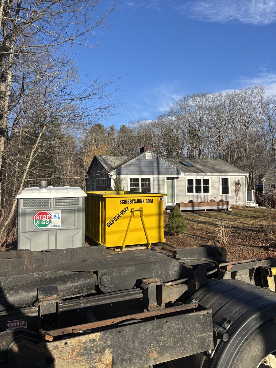A Scribby's dumpster on a Pembroke driveway. Maybe a residential roof job in a neighborhood near Pembroke Academy.
