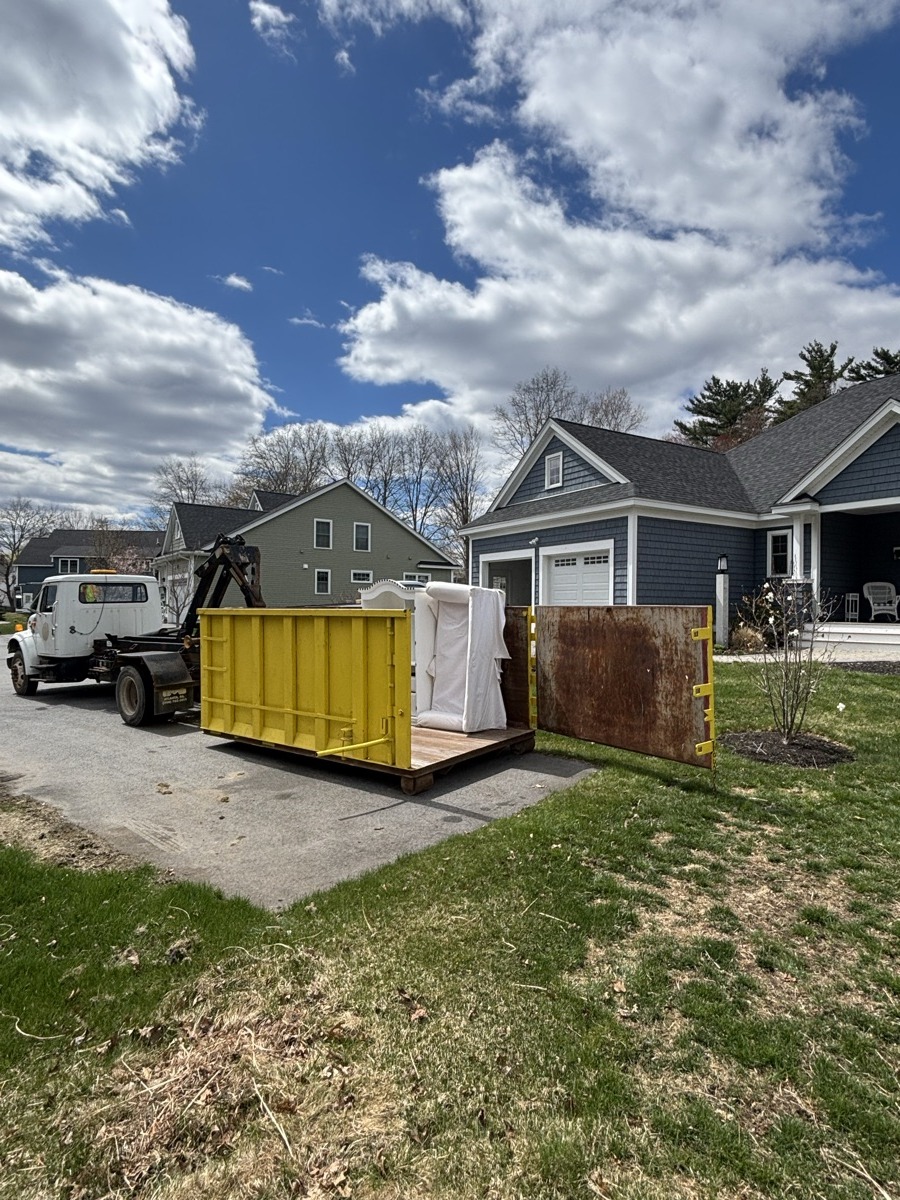 Scribby's dumpster on a Haverhill driveway. A Haverhill residential or commercial job, or a residential job out toward Bradford.