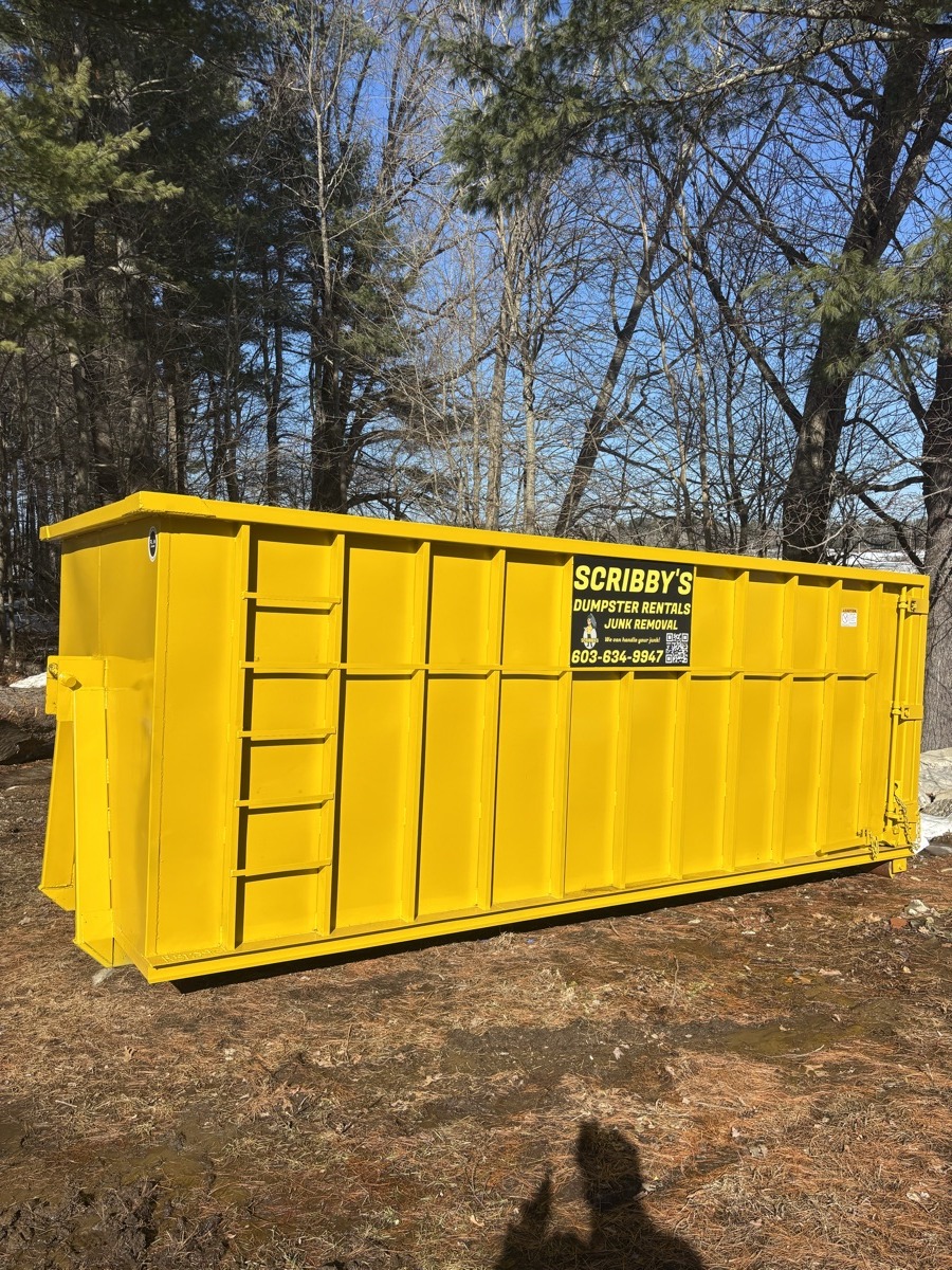 A Scribby's dumpster on an Allenstown driveway. Maybe a residential project near the Suncook River.