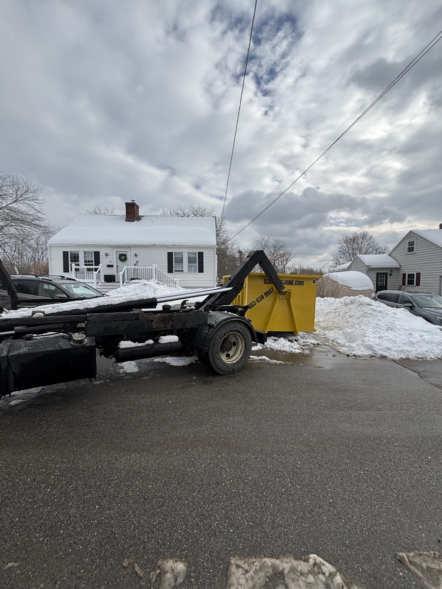 A Scribby's dumpster on a Pittsfield driveway. Maybe a residential project near the Suncook River.